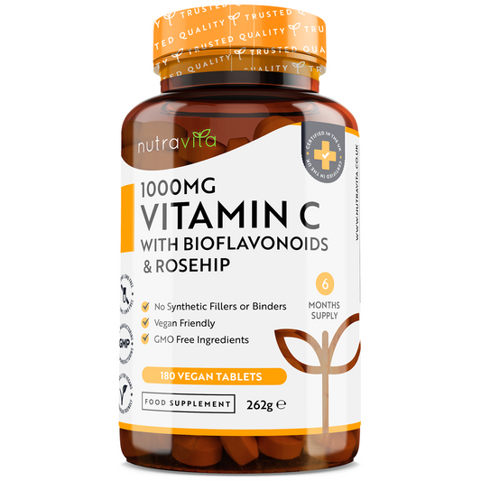A bottle of Nutravit 1000MG Vitamin C with Bioflavonoids & Rosehip, 180 vegan tablets, shown on a clean white background. The amber bottle and cap are visible, along with the white and orange label detailing the product features.