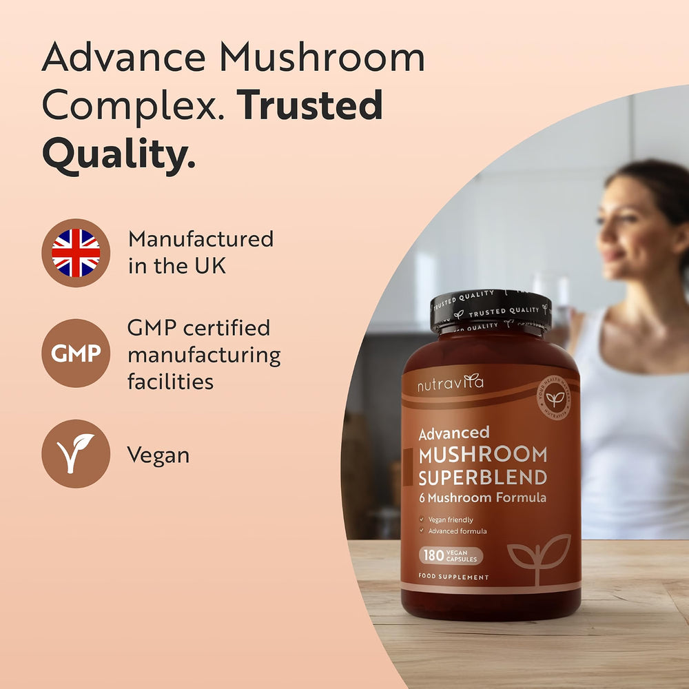 A bottle of NutraVita Advanced Mushroom Superblend 4 Mushroom Formula food supplement is featured on a light peach background with marketing text highlighting 'Trusted Quality', 'Manufactured in the UK', 'GMP certified manufacturing facilities', and 'Vegan'. A blurred woman is visible in the background of the product photo.
