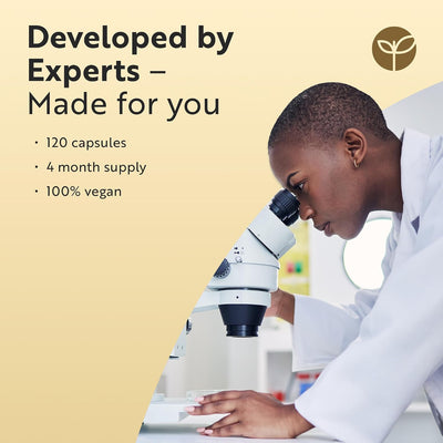 Person using a microscope with promotional text about product details on a beige background