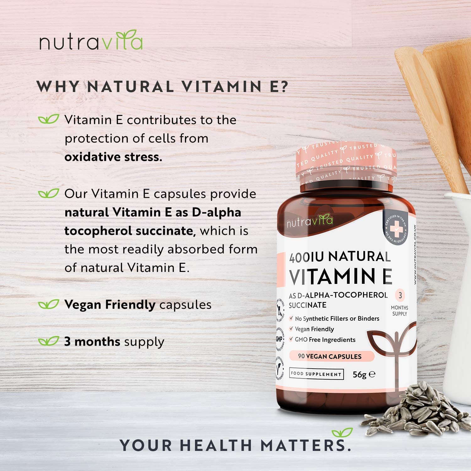 Nutravita Vitamin E supplement bottle with text on a light wooden background